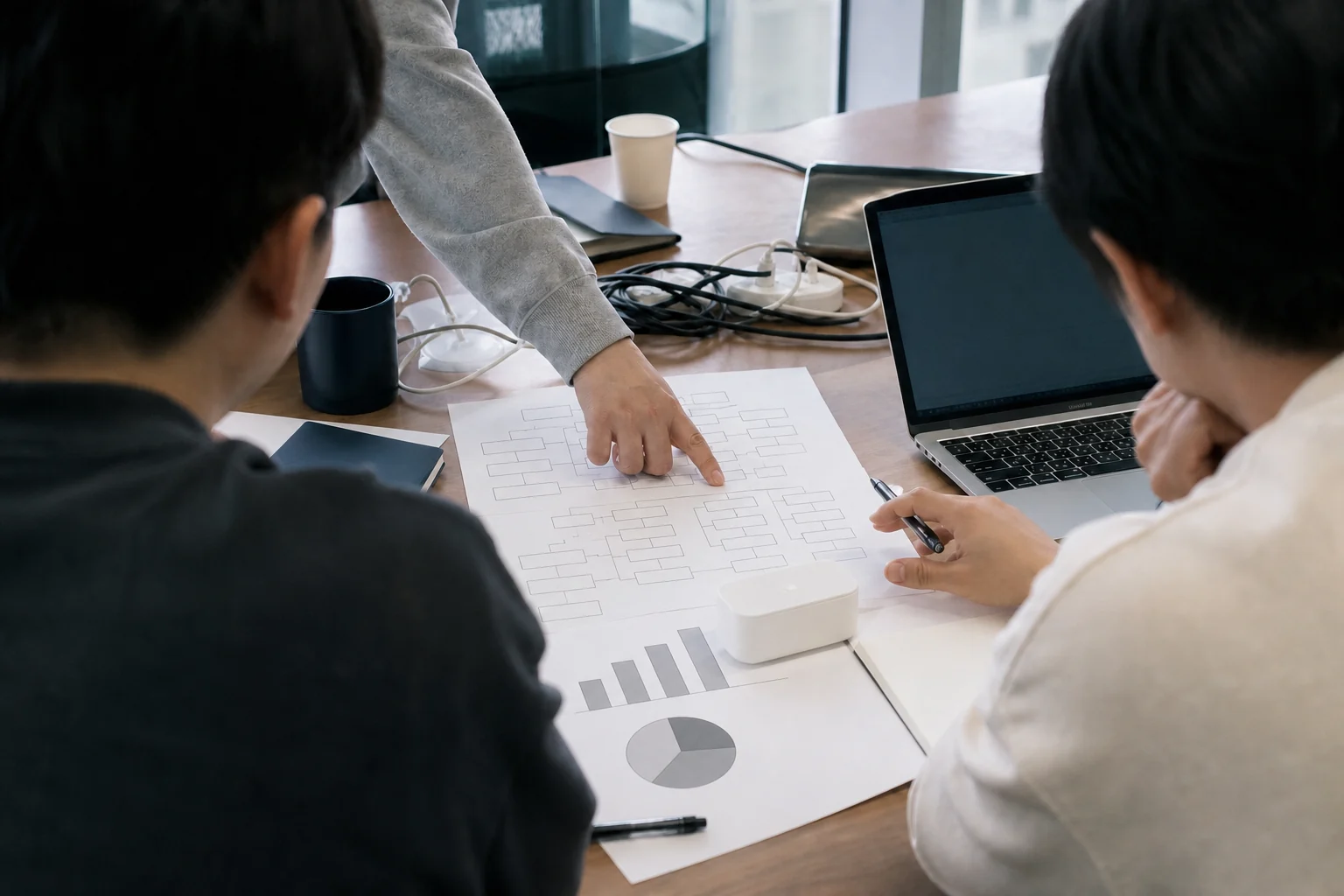 Illustrative scene of people discussing a software project around a table